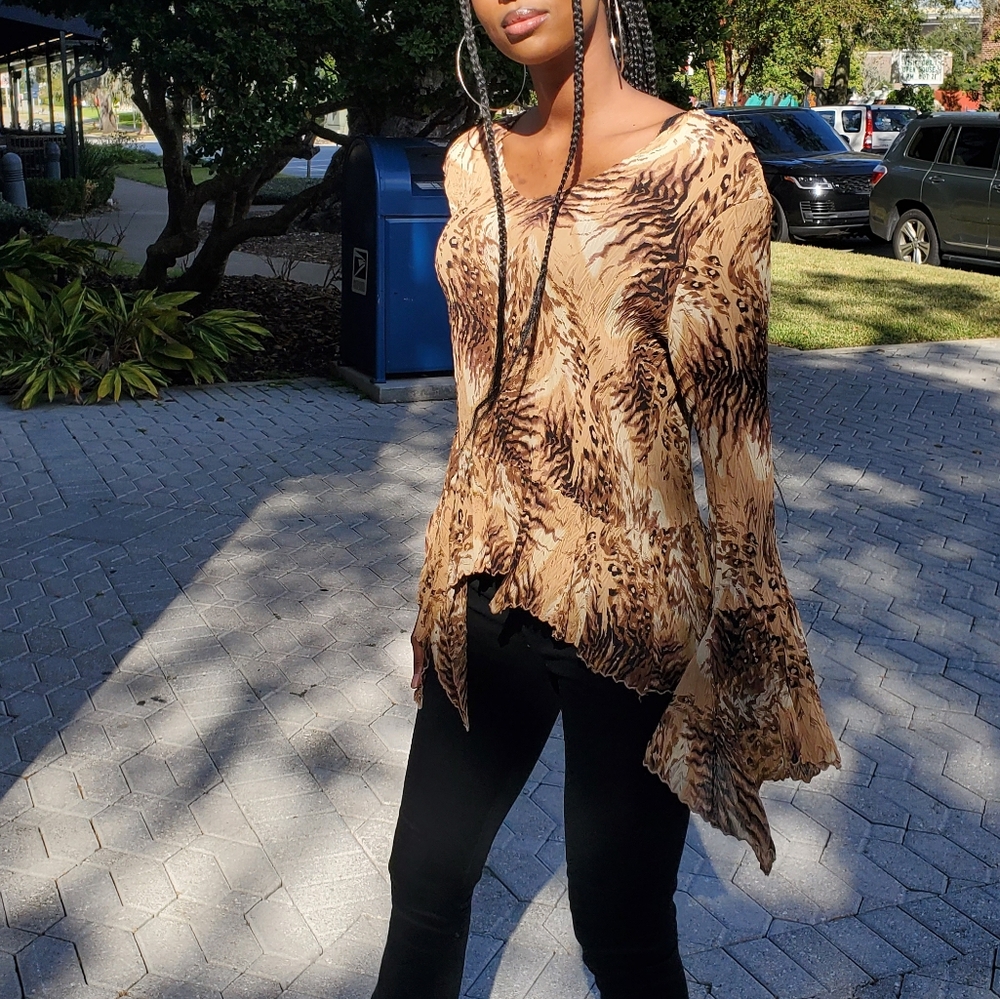 Cheetah print / muli pattern printed top Multi color pallet of browns tans